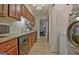 Kitchen with stainless steel appliances, tile backsplash, and plenty of cabinet space at 26 Cobblestone Crk, Peachtree City, GA 30269