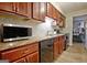 Cozy kitchen with granite countertops, tile backsplash, and stainless appliances at 26 Cobblestone Crk, Peachtree City, GA 30269