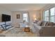 Comfortable living room area with a large window, a recliner, and carpet at 26 Cobblestone Crk, Peachtree City, GA 30269
