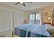 Main bedroom with a view of the balcony, window and closets at 26 Cobblestone Crk, Peachtree City, GA 30269
