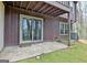 View of covered patio with sliding glass doors leading to the backyard at 26 Cobblestone Crk, Peachtree City, GA 30269