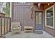 Cozy front porch with seating, string lights and a view of the front door at 26 Cobblestone Crk, Peachtree City, GA 30269