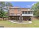 Backyard featuring a deck, covered patio, stairwell and finished basement at 1085 Crown River Pkwy, Mcdonough, GA 30252