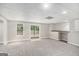 Finished basement with a sliding glass door, neutral walls, and recessed lighting at 1085 Crown River Pkwy, Mcdonough, GA 30252