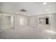 Spacious finished basement with neutral carpet, open layout, and multiple rooms to use as needed at 1085 Crown River Pkwy, Mcdonough, GA 30252