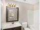Bathroom vanity with a large mirror and neutral walls at 1085 Crown River Pkwy, Mcdonough, GA 30252