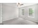 Bedroom with large windows offering lots of natural light and a ceiling fan at 1085 Crown River Pkwy, Mcdonough, GA 30252