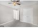 Neutral bedroom features include a ceiling fan, double door closet, and soft carpet at 1085 Crown River Pkwy, Mcdonough, GA 30252