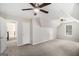 Large bedroom features carpet, neutral walls, ceiling fans, and natural light at 1085 Crown River Pkwy, Mcdonough, GA 30252