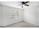 Bedroom featuring natural light, carpet, neutral walls, and a ceiling fan at 1085 Crown River Pkwy, Mcdonough, GA 30252