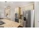 Modern kitchen with granite countertops, stainless appliances, and custom cabinetry at 1085 Crown River Pkwy, Mcdonough, GA 30252