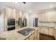 Spacious kitchen features stainless steel appliances, granite countertops, and modern lighting at 1085 Crown River Pkwy, Mcdonough, GA 30252
