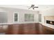 Cozy living room with a fireplace, hardwood floors, and access to the backyard at 1085 Crown River Pkwy, Mcdonough, GA 30252