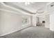 Spacious main bedroom with ceiling fans, large window, and tray ceiling at 1085 Crown River Pkwy, Mcdonough, GA 30252