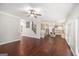 Spacious open concept with hardwood floors leading to the kitchen and stairs at 1085 Crown River Pkwy, Mcdonough, GA 30252