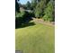 Wide shot of backyard featuring grass and fence at 2681 Mariner Way, Villa Rica, GA 30180