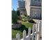 Charming home exterior featuring a well-manicured front yard, quaint fountain, and a two-car garage at 2681 Mariner Way, Villa Rica, GA 30180