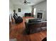 Bright and airy living room featuring plush seating, hardwood floors, and a cozy fireplace at 2681 Mariner Way, Villa Rica, GA 30180