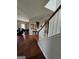 Open-concept living space featuring hardwood floors and arched doorway, seamlessly connecting to other areas at 2681 Mariner Way, Villa Rica, GA 30180