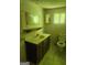 Bathroom featuring a toilet, vanity and mirror with good lighting and a tile floor at 4 Maple St, Porterdale, GA 30014