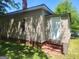 Rear exterior view of home with siding, a back door, and grass at 4 Maple St, Porterdale, GA 30014