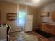 Kitchen featuring wood cabinets, an oven and a refrigerator at 4 Maple St, Porterdale, GA 30014