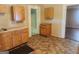 Kitchen featuring wood cabinets and tiled floors at 4 Maple St, Porterdale, GA 30014