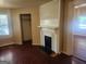 Living room featuring hard wood floors, a fireplace and a coat closet at 4 Maple St, Porterdale, GA 30014