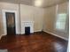Living room featuring a fireplace and hardwood floors at 4 Maple St, Porterdale, GA 30014
