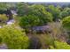 An aerial shot showing a home nestled among mature trees in a serene and private setting at 362 Highway 113, Temple, GA 30179