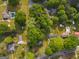 Aerial view of the neighborhood, showcasing the home and surrounding mature trees at 362 Highway 113, Temple, GA 30179