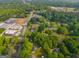 Aerial view of the neighborhood, showcasing the home and surrounding commercial area at 362 Highway 113, Temple, GA 30179
