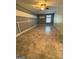Finished basement with gray walls, white trim, tile floors, and a ceiling fan at 9022 Homewood Dr, Riverdale, GA 30274