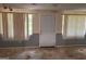 Unfinished basement with gray walls, white trim, and a ceiling fan at 9022 Homewood Dr, Riverdale, GA 30274