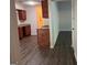 Spacious kitchen with dark cabinets, granite countertop, and hard wood flooring at 9022 Homewood Dr, Riverdale, GA 30274