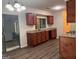 Spacious kitchen with dark cabinets, granite countertop, and hard wood flooring at 9022 Homewood Dr, Riverdale, GA 30274