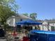 Backyard with an above-ground pool, patio area, and a partial view of the home's exterior at 3143 S West St, Covington, GA 30014
