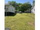 Grassy backyard enclosed with fencing provides ample space for outdoor activities and relaxation at 3143 S West St, Covington, GA 30014