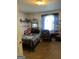 View of the bedroom featuring carpet, a window with a graphic, and neutral-colored walls at 3143 S West St, Covington, GA 30014