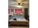 Primary bedroom featuring a ceiling fan, a window, and neutral-colored walls at 3143 S West St, Covington, GA 30014