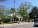 Side angle shot of a single-story home, showcasing a well-maintained front yard and covered front porch at 3143 S West St, Covington, GA 30014