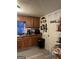 Well-equipped kitchen with wood cabinets and efficient workspace at 3143 S West St, Covington, GA 30014