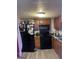 Kitchen with appliances and cabinets at 3143 S West St, Covington, GA 30014