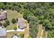 An aerial view displays a home with a large yard, mature trees, and a private backyard at 330 Noah Pl, Mcdonough, GA 30252