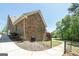Brick home exterior with a fenced yard, patio, and easy access to the backyard at 330 Noah Pl, Mcdonough, GA 30252