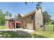 Brick home with a deck, screened porch, fenced backyard, and garage at 330 Noah Pl, Mcdonough, GA 30252