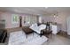Cozy basement with natural light, a living area with bar and a doorway to the outdoors at 330 Noah Pl, Mcdonough, GA 30252