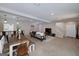 Open basement with a full living area, dining space, and bar for relaxation and entertainment at 330 Noah Pl, Mcdonough, GA 30252