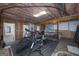 Partially finished basement with workout equipment and ping pong table at 330 Noah Pl, Mcdonough, GA 30252