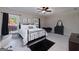 Comfortable bedroom featuring neutral tones, a wrought iron bed frame and ample natural light at 330 Noah Pl, Mcdonough, GA 30252